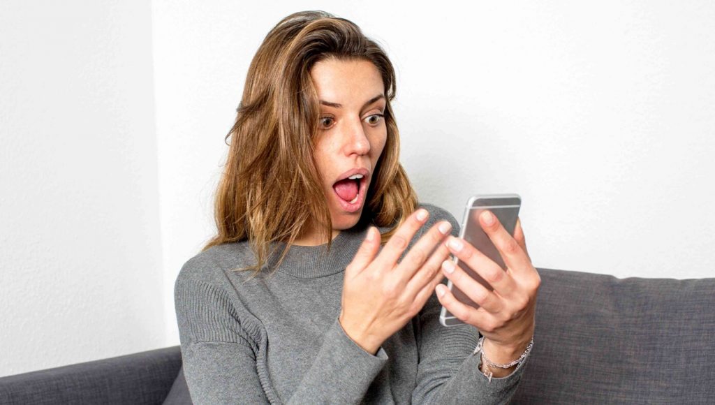 SATIRE – Wife’s Loud Gasp While Reading Phone Means Either Someone Died Or Got A New Handbag