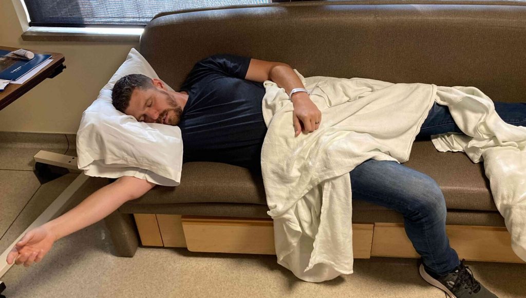 SATIRE – New Dad Recovering After Spending Night On Uncomfortable Hospital Bench With Limited Snacks