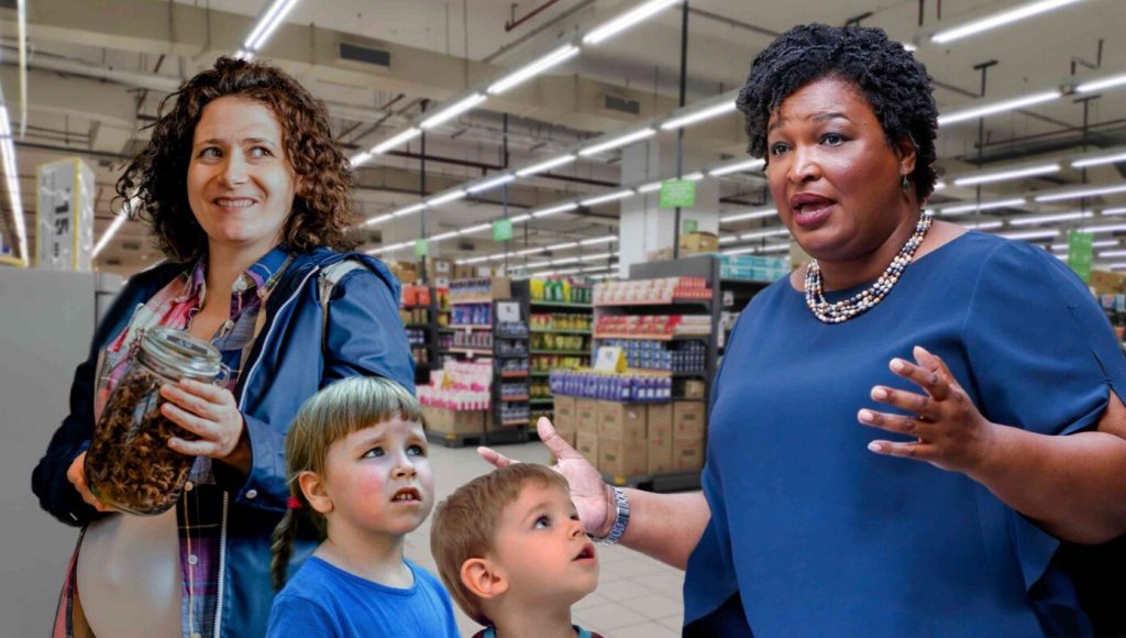 SATIRE – Stacey Abrams Spotted At The Grocery Checkout Reminding Parents This Would All Be Cheaper If They Aborted Their Kids