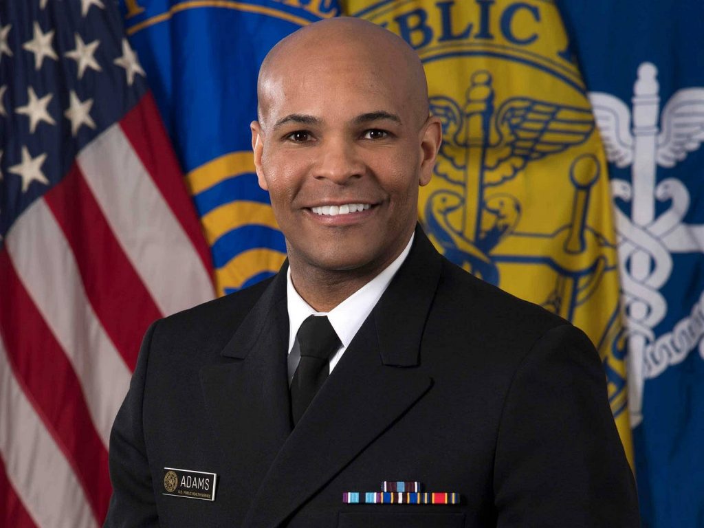 Former US Surgeon General Jerome Adams runs for cover when challenged