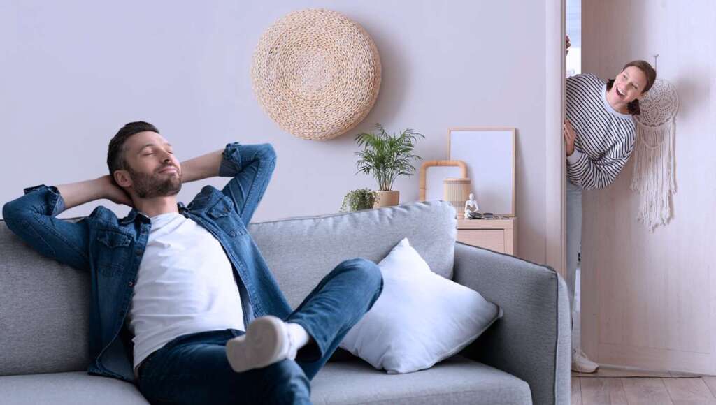 Sound Of Husband Plopping Down On Couch Helpfully Reminds Wife There’s Something She Wanted Him To Do (Satire)