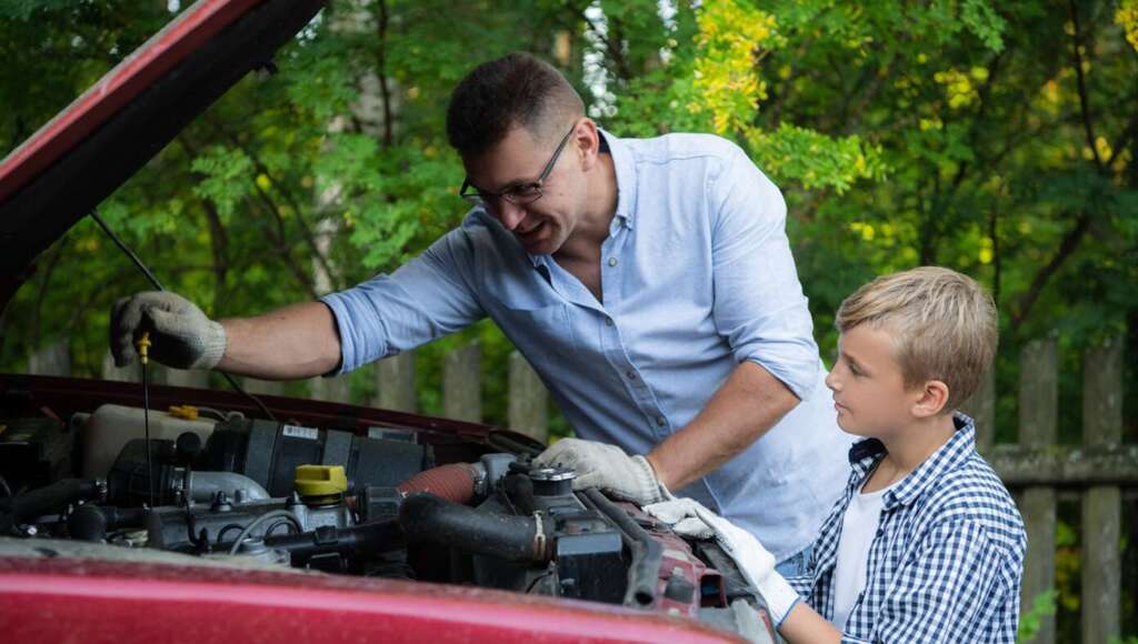 Dad Teaches Son Importance Of Doing Your Own Oil Changes So It Will Take Longer And Cost More (Satire)