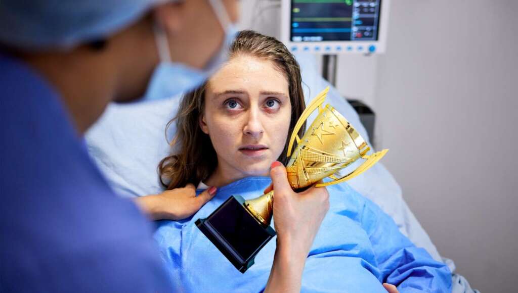 Woman Awarded Trophy For Enduring 17 Hours Of Senseless Agony Instead Of Getting Epidural (Satire)